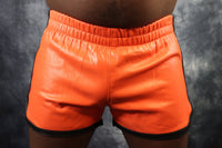 OnF Booty Shorts in Orange with Black - front view
