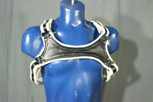 Black and white leather harness with keystone highlight. - front view